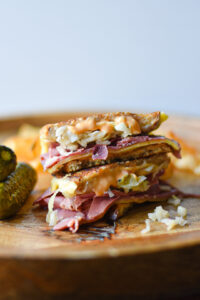 Shows finished reuben sandwich